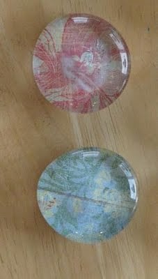 2 finished marble magnets made with scrapbook paper