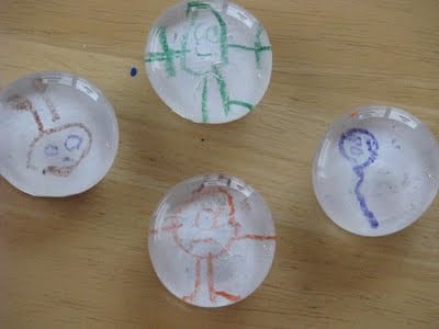 4 marble magnets made with kids drawings