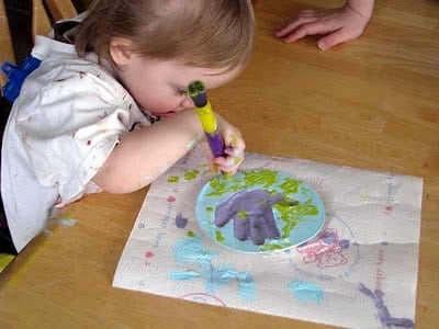 toddler painting plaster handprint