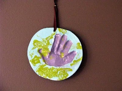 toddler plaster handprint hanging on wall