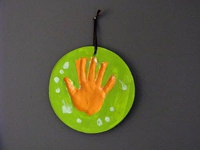 child plaster hand print on wall
