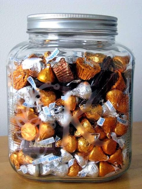 large jar filled with chocolate candy