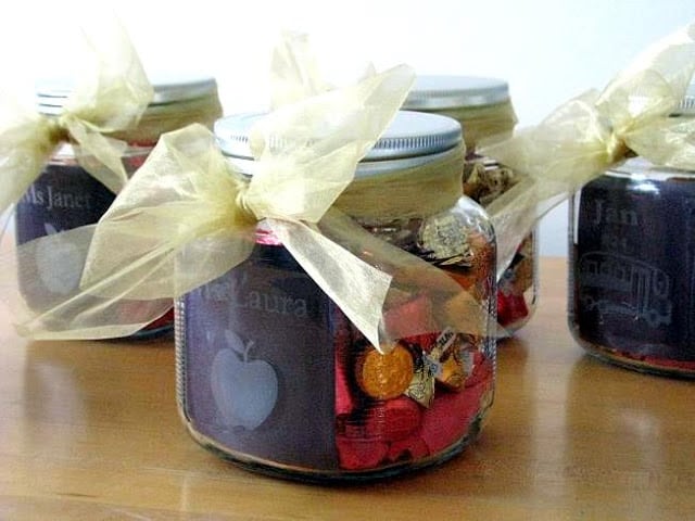 4 acid etched jars wrapped with ribbon