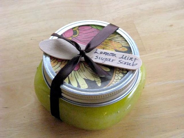 jar of sugar scrub with wooden spoon