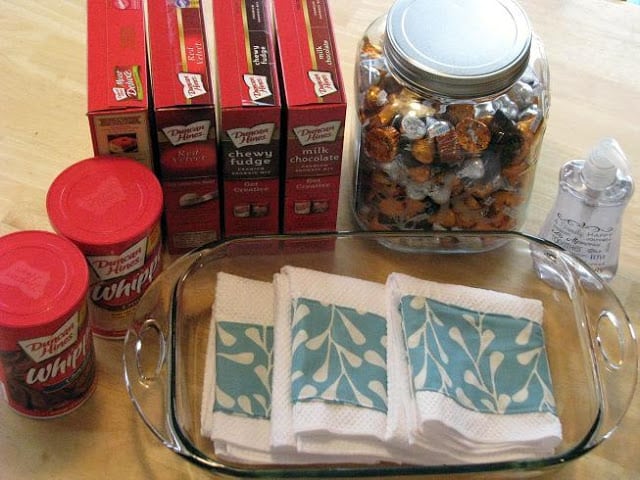 casserole dish with baking mixes and 2 containers of frosting