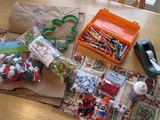 table with brown bags and craft supplies