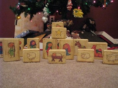 blocks of wood with nativity stickers on each block