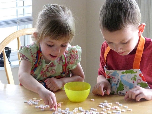 kids separating Smarties candies