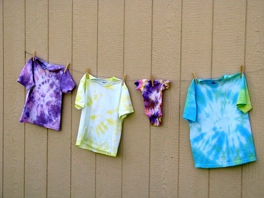 finished tie dyed shirts drying on clothesline