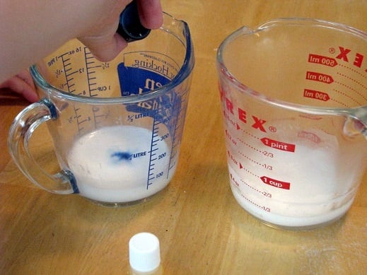 two measuring cups with melted glycerin soap