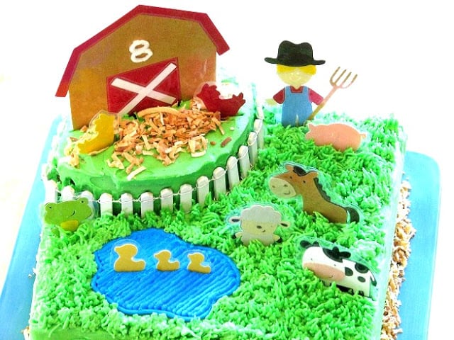 barnyard cake with barn and grass and laminated animals