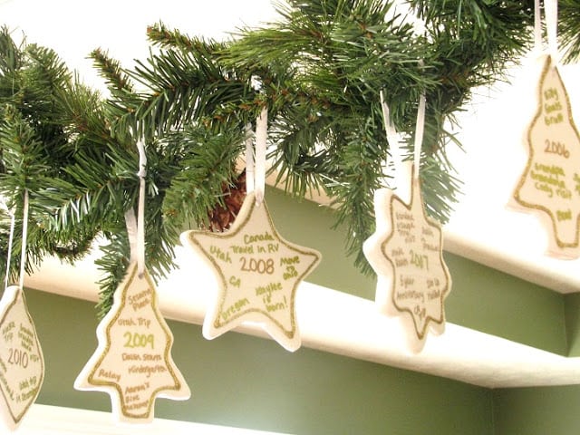 memory ornaments hanging on evergreen swag