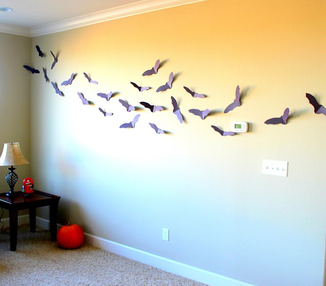 paper bats on a wall