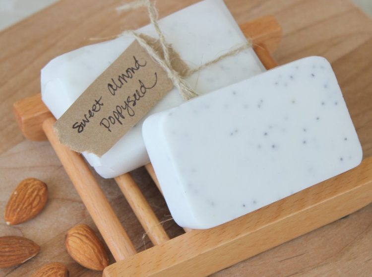 two bars of poppy seed soap on soap holder