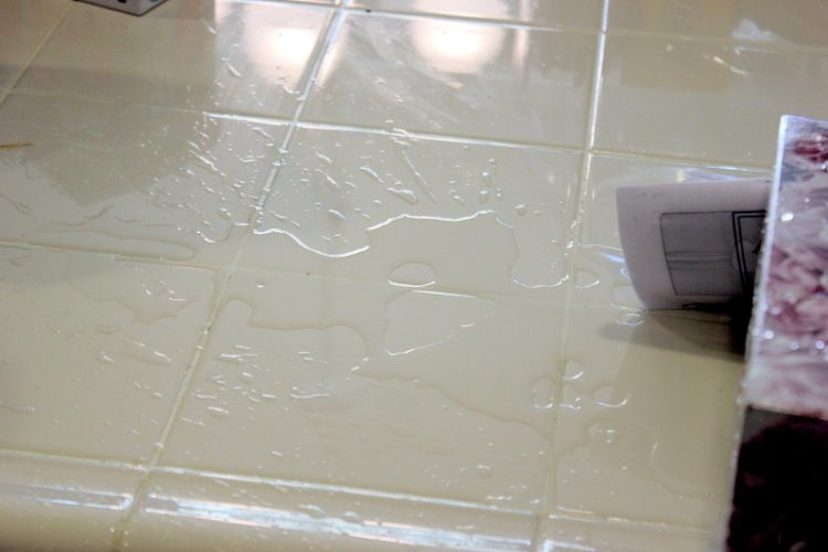 puddle of water on tile counter
