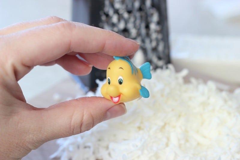 small fish toy next to pile of shredded soap