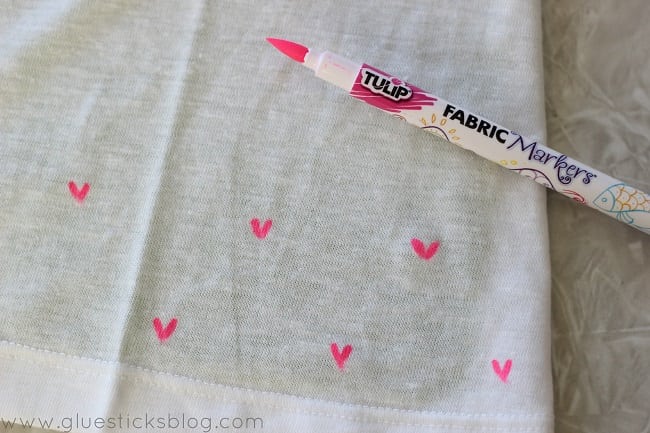 pink fabric pen and white shirt