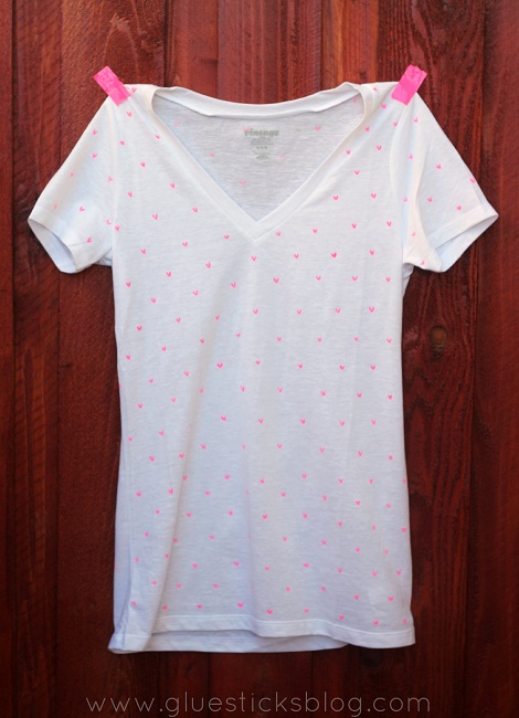 white shirt with mini pink hearts drawn on it