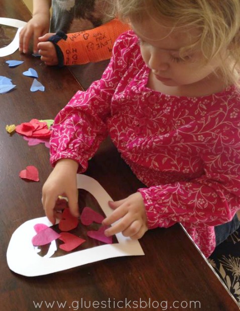 toddler making sun catcher