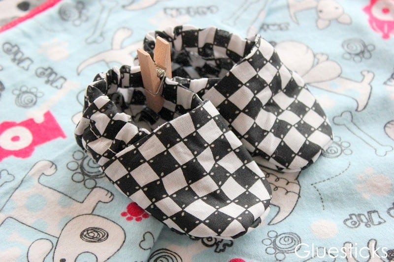 pair of black and white checked baby shoes