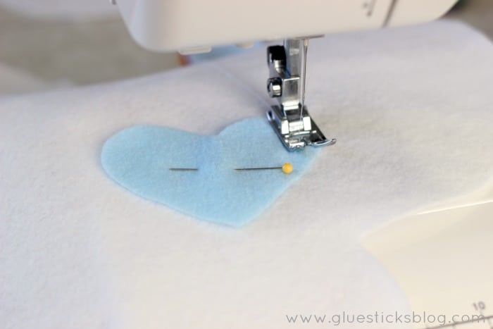 blue heart pinned to fabric
