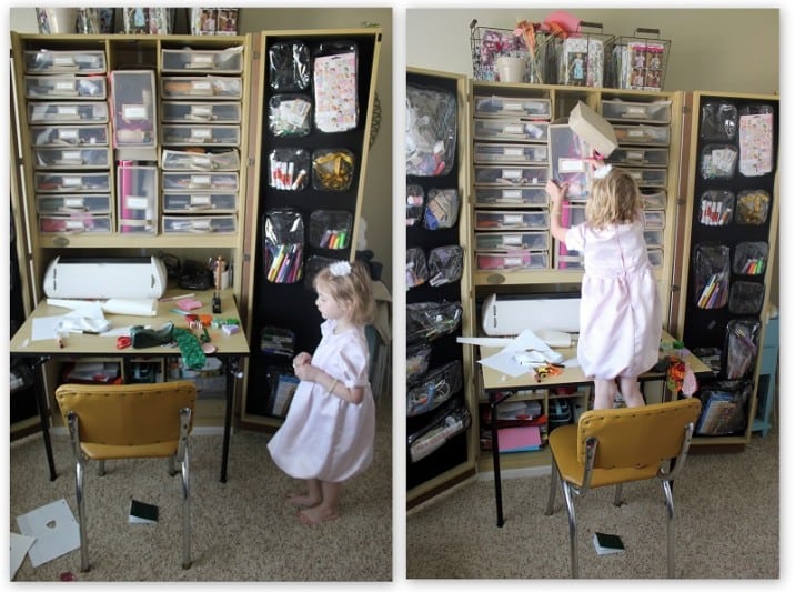 toddler climbing by craft cabinet