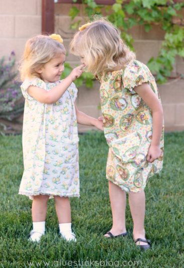 little girls wearing cotton peasant dresses