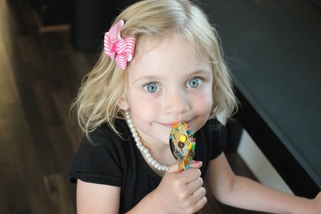 toddler with peanut butter spoon