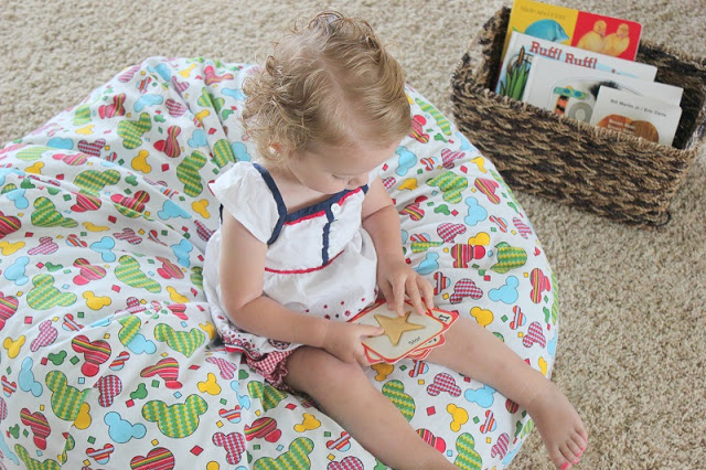 toddler sitting on bean bag