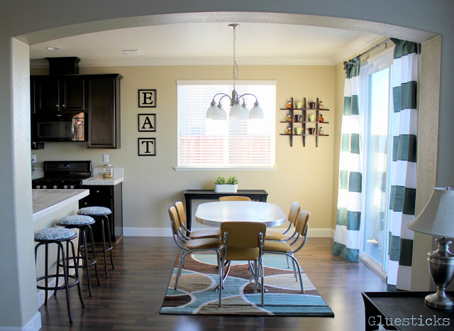 kitchen with vintage table set and horizontal curtains