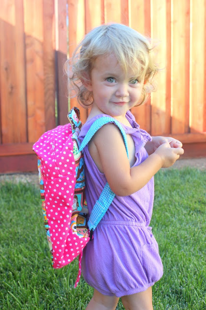 toddler wearing homemade backpack