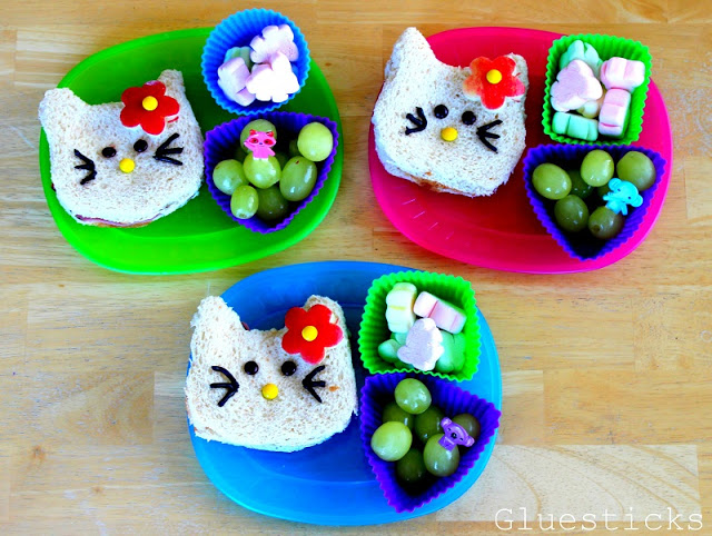 hello kitty shaped sandwiches on colored plates