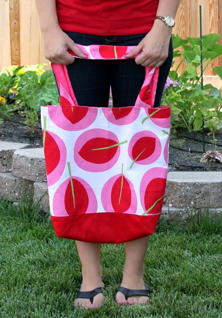 woman holding canvas tote