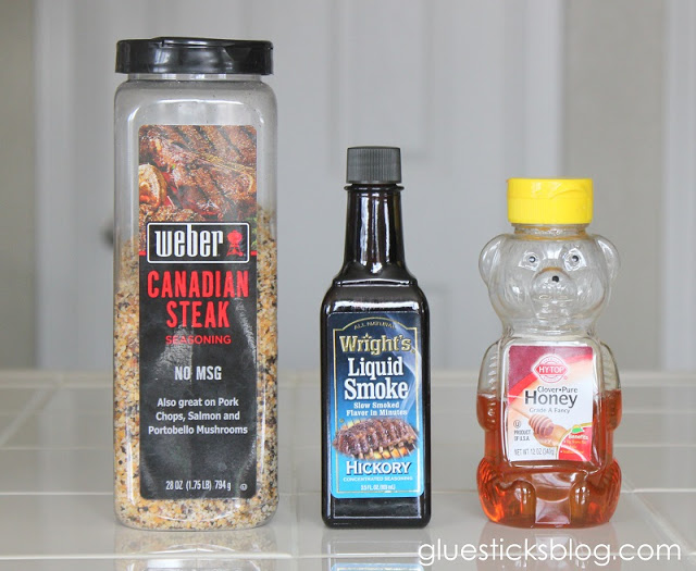 a bottle of canadian steak seasoning, liquid smoke, bottle of honey