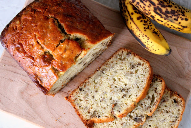 finished banana bread sliced on cutting board