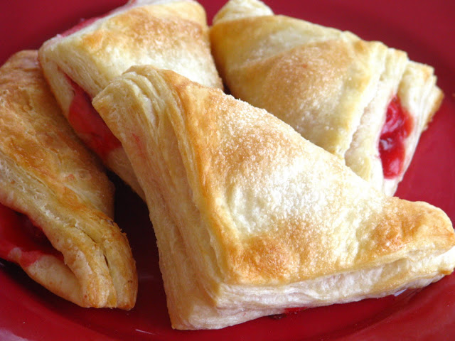 finished cherry turnovers made with puff pastry on serving platter