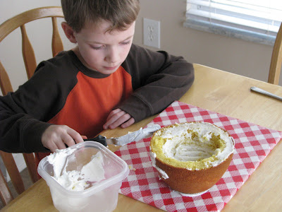 child frosting round cake