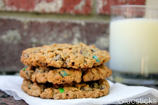 3 monster cookies stacked on napkin
