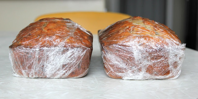 warm banana bread wrapped in plastic wrap