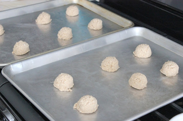 cookie dough balls on baking sheet