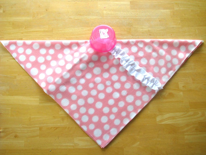 pink fleece folded into a triangle 