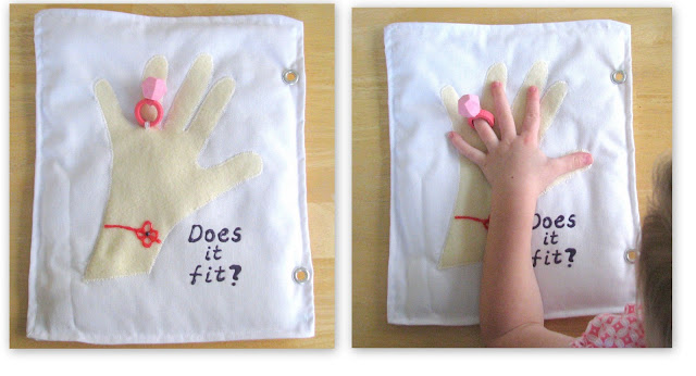 quiet book page with hand and ring. Child putting hand through ring.