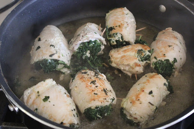 8 chicken breasts cooking in pan