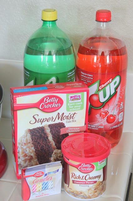 cake mix, frosting and two bottles of soda