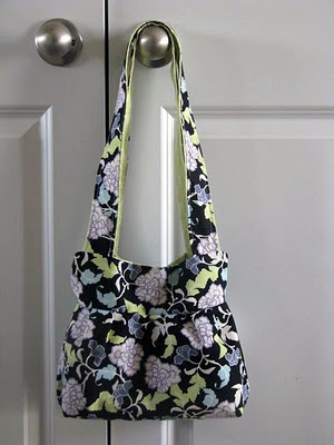 small handbag with purple floral fabric