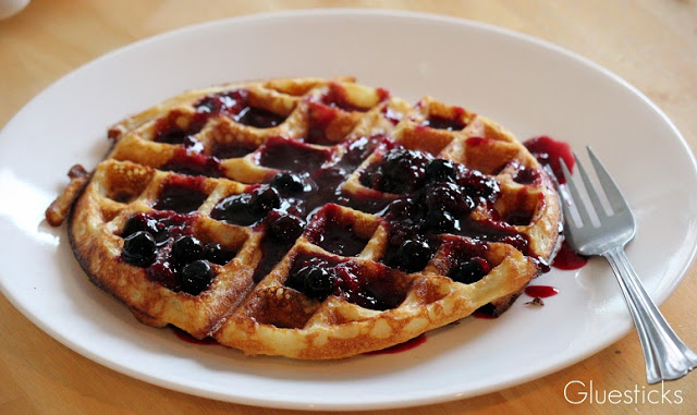crispy waffles with blueberry sauce
