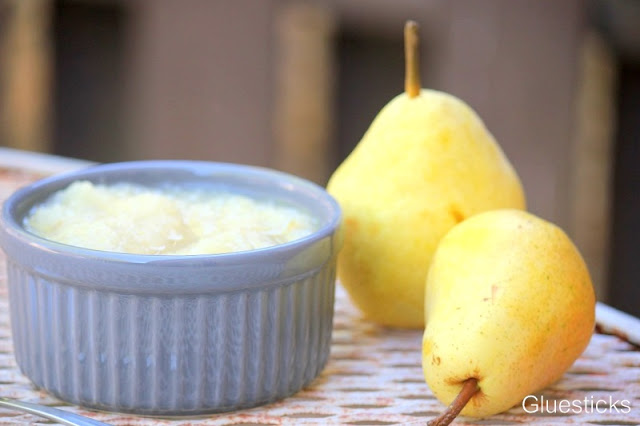 pear sauce in ramekin next to fresh pears