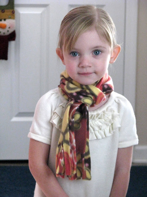 little girl wearing fleece scarf