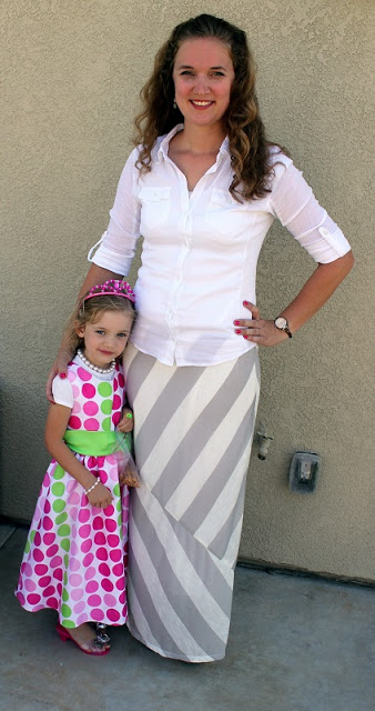 mom and daughter standing together