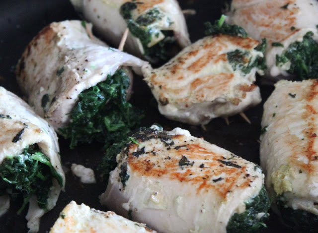 chicken breasts seared in pan with spinach